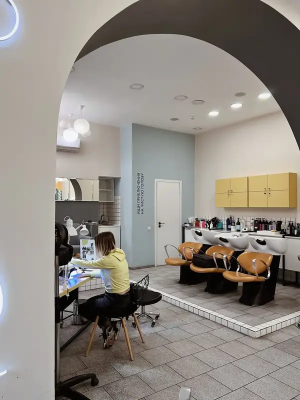 16-station styling floor — natural light throughout
