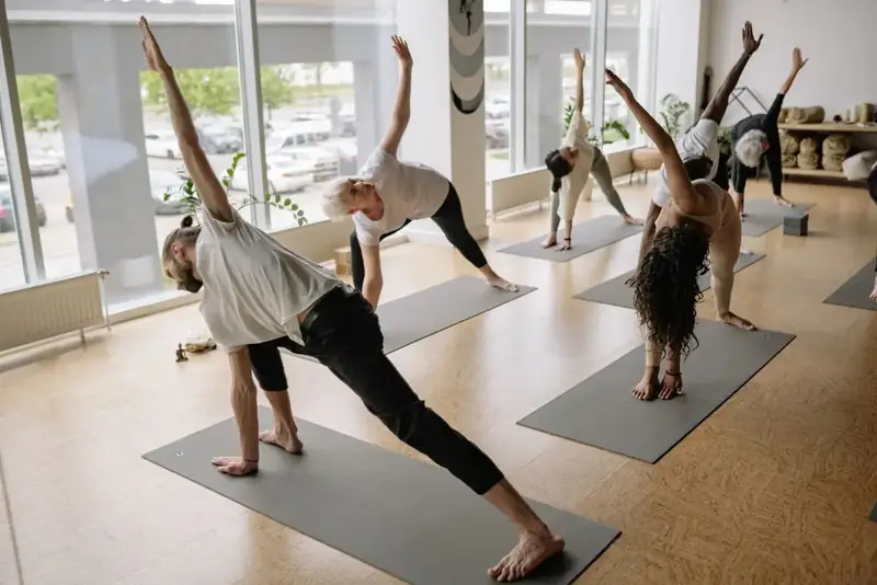 A led flow class in a studio full of morning light